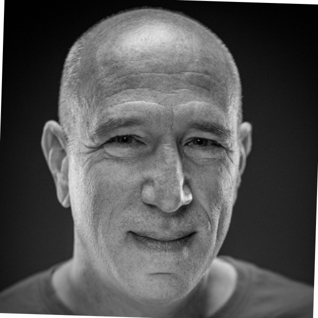 Black and white professional headshot of data storytelling expert Bill Shander, guest on Counsel Cast.