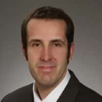 Professional studio headshot of Jared Correia, Co-Founder of Legal Broadcasting Company and Founder of Red Cave Law Firm Consulting.