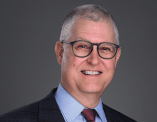 Professional portrait headshot of Professor John Q. Barrett of St. John's University School of Law.