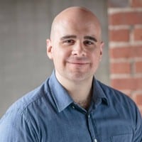 Professional headshot of Phil Rozek, CEO of Local Visibility System, wearing a blue collared shirt.